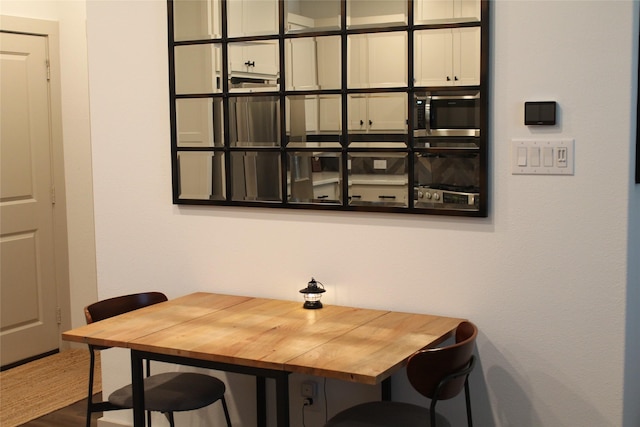 dining room with hardwood / wood-style floors