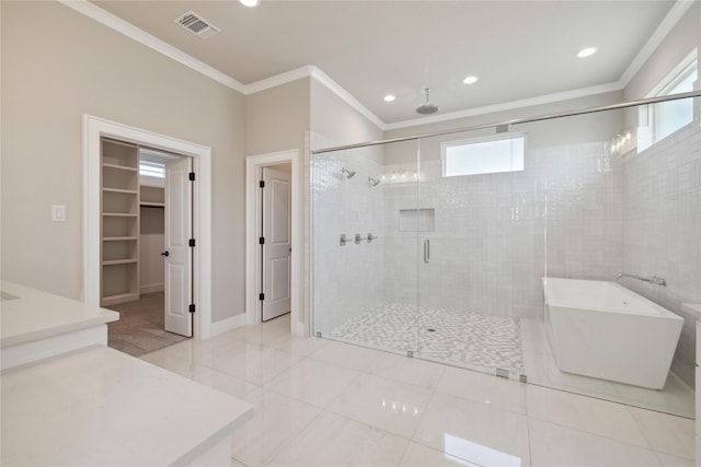 bathroom with crown molding, tile patterned floors, and independent shower and bath