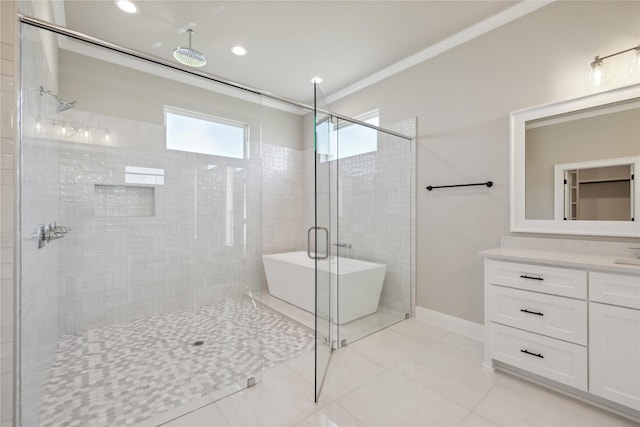 bathroom featuring tile patterned floors, ornamental molding, separate shower and tub, and vanity