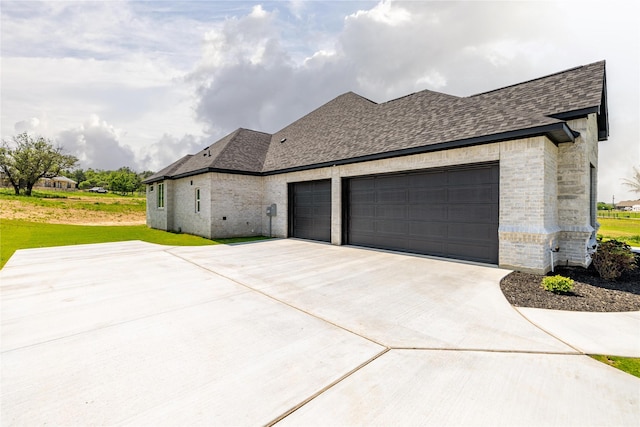 view of side of property with a garage