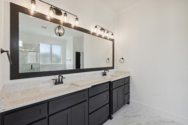 bathroom featuring vanity and a shower with shower door