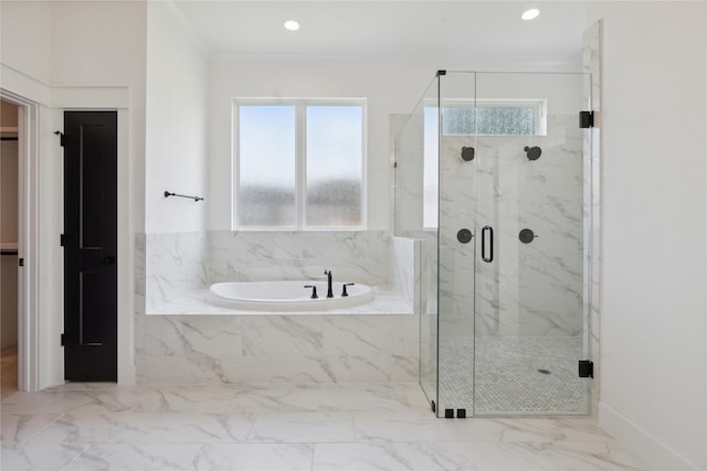 bathroom with ornamental molding, plus walk in shower, and a wealth of natural light