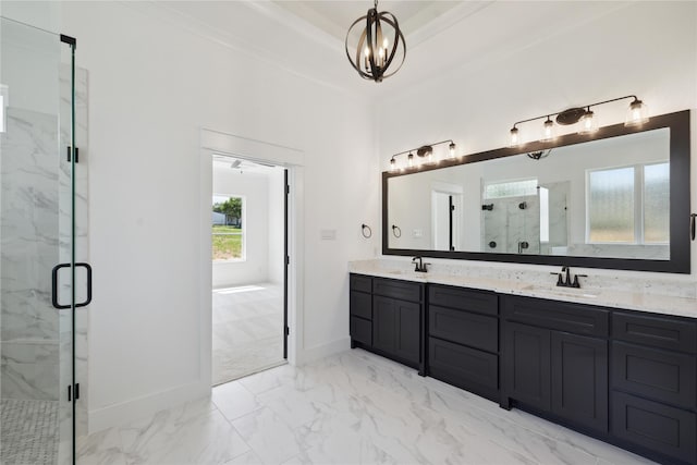 bathroom with vanity, a tray ceiling, a chandelier, and a shower with door