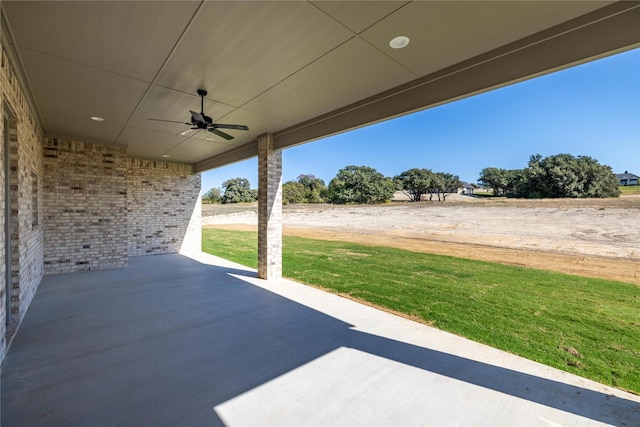 view of patio featuring ceiling fan