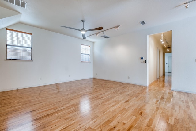 2002 Moser Ave, Dallas, TX 75206 - empty room featuring ceiling fan, track lighting, and light hardwood / wood-style floors