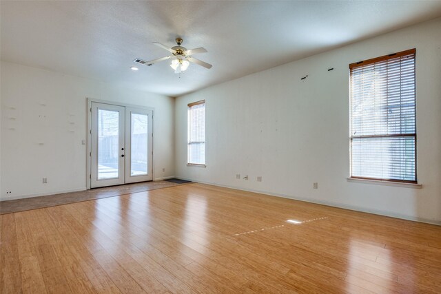 2002 Moser Ave, Dallas, TX 75206 - unfurnished room featuring french doors, ceiling fan, and light hardwood / wood-style floors