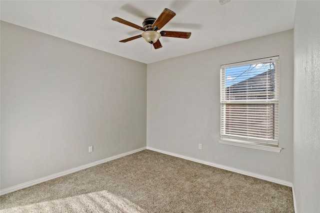 empty room with ceiling fan and carpet floors