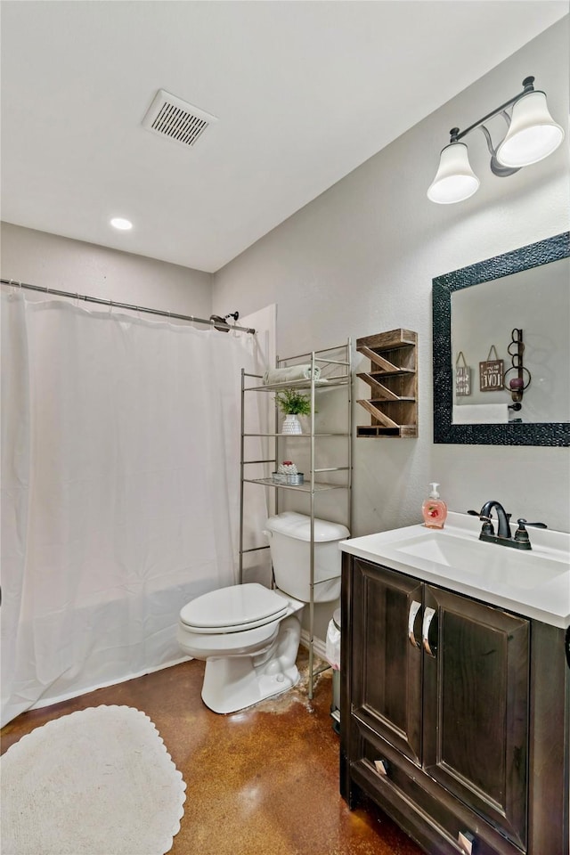 bathroom featuring vanity and toilet