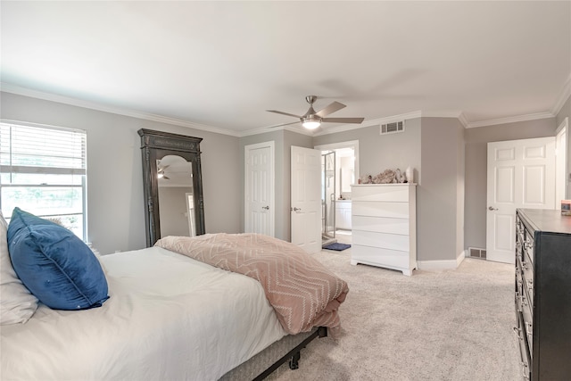 carpeted bedroom with ceiling fan, ornamental molding, and connected bathroom