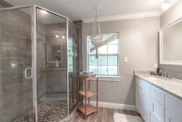 bathroom featuring vanity, hardwood / wood-style floors, crown molding, and walk in shower