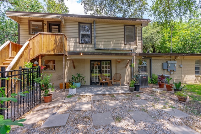 back of house with a patio