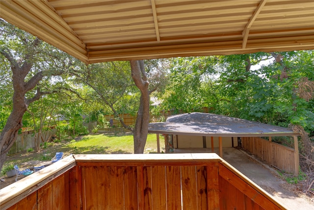 wooden terrace with a lawn