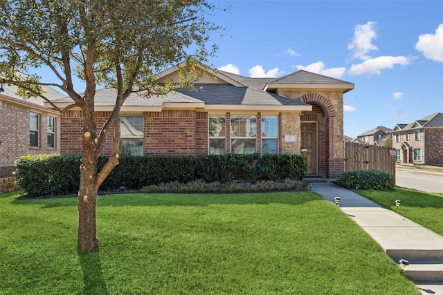 ranch-style house with a front lawn