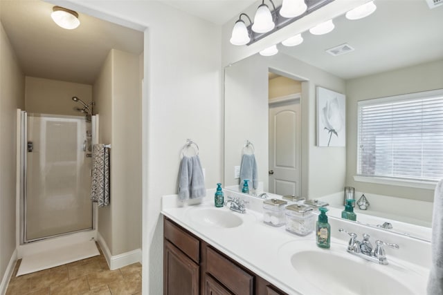 bathroom with vanity, tile patterned flooring, and a shower with door