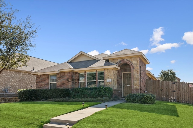 ranch-style home with a front yard