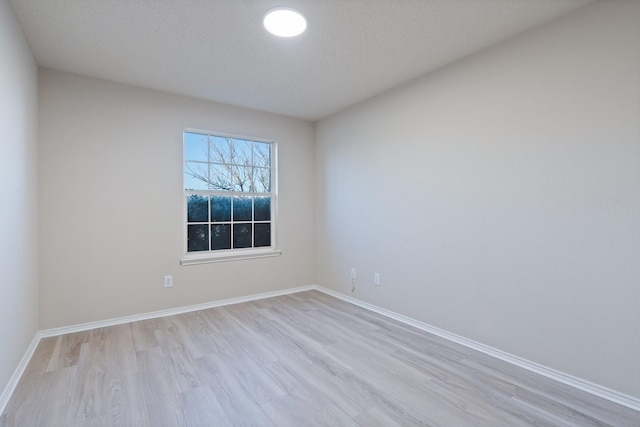 unfurnished room featuring light wood-type flooring