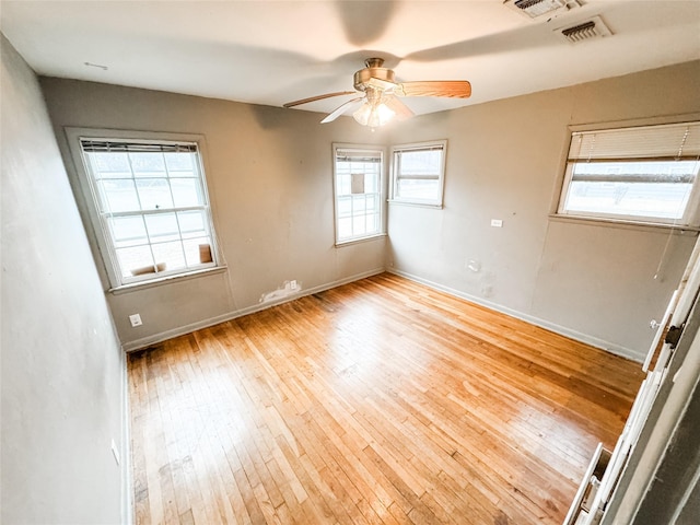 unfurnished room with ceiling fan and light hardwood / wood-style floors