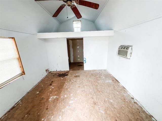 spare room featuring ceiling fan, high vaulted ceiling, and a wall unit AC