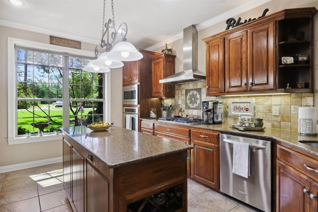 kitchen with crown molding, appliances with stainless steel finishes, a center island, tasteful backsplash, and wall chimney exhaust hood