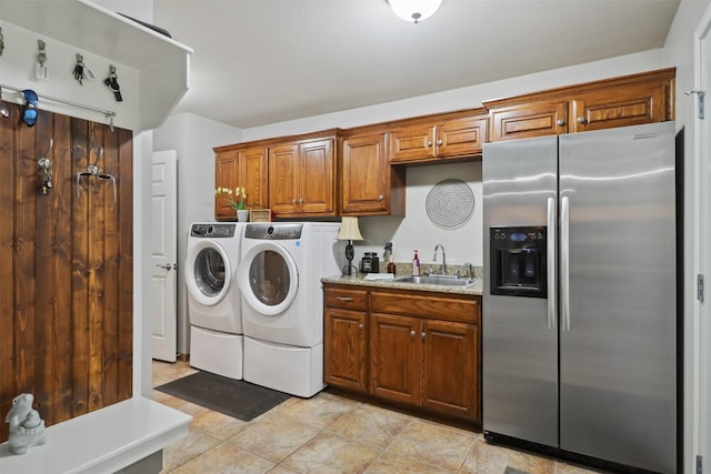 laundry area with sink and washing machine and dryer