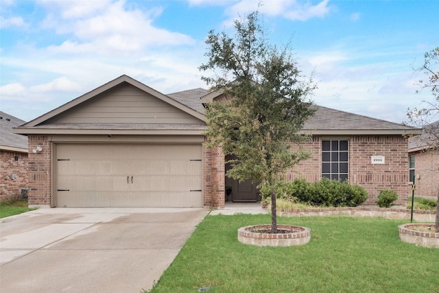 single story home featuring a garage and a front lawn