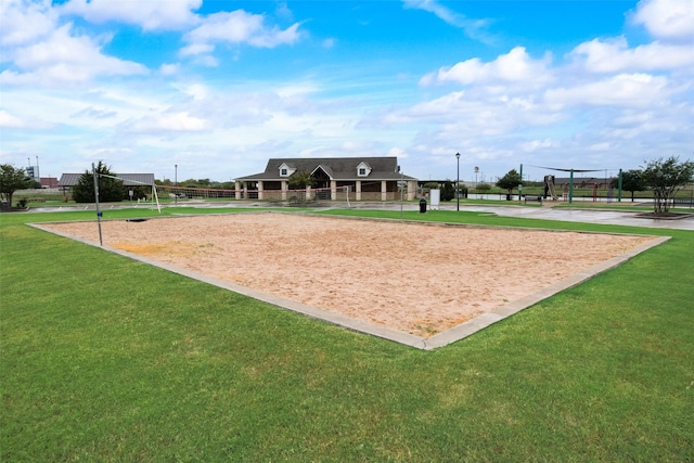 view of home's community with a lawn and volleyball court