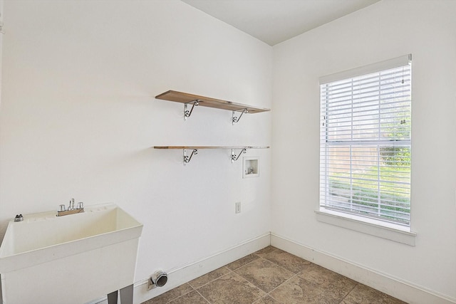 clothes washing area featuring washer hookup and sink