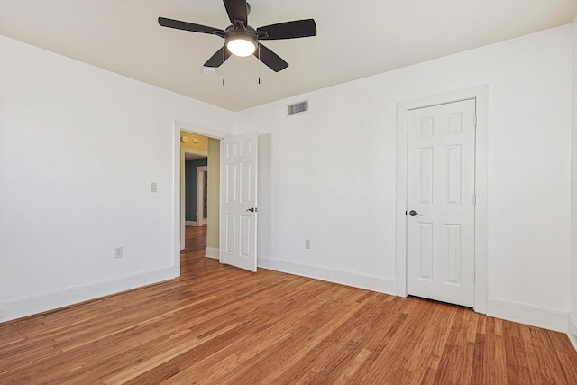 unfurnished room featuring ceiling fan and light hardwood / wood-style flooring