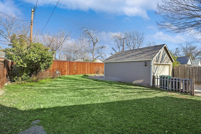 view of yard featuring a garage and an outdoor structure