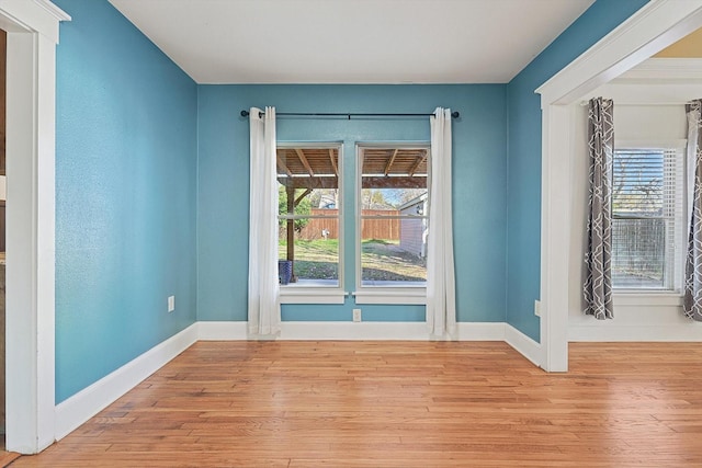 empty room with light hardwood / wood-style floors