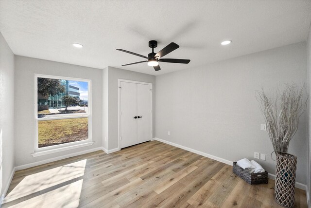 unfurnished bedroom with vaulted ceiling with beams, ensuite bath, ceiling fan, access to exterior, and light hardwood / wood-style floors