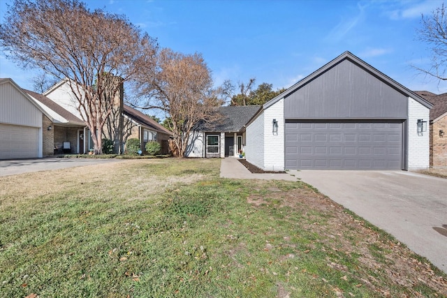 view of front of house with brick siding, an attached garage, driveway, and a front lawn