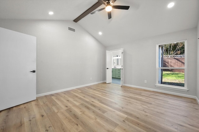 unfurnished bedroom featuring connected bathroom, light hardwood / wood-style flooring, lofted ceiling with beams, and ceiling fan