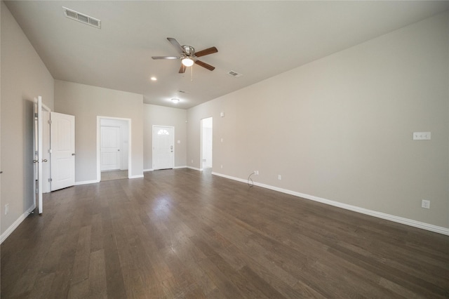 unfurnished room with dark hardwood / wood-style floors and ceiling fan