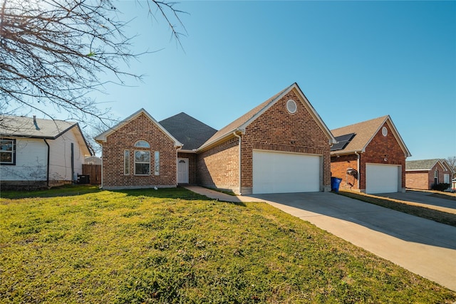 view of front of home with a garage and a front yard