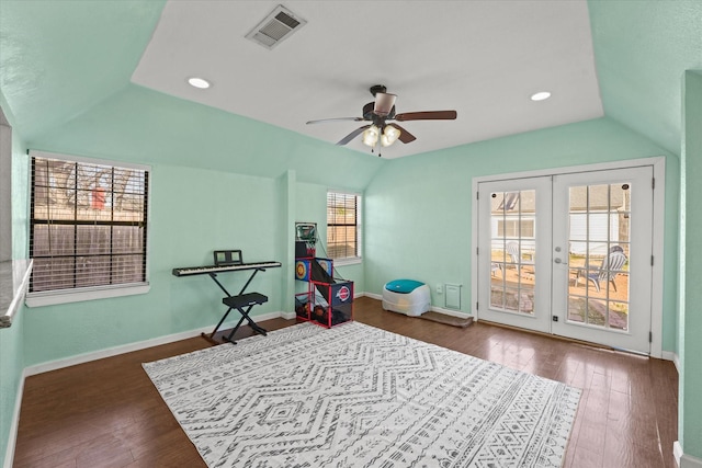 recreation room featuring dark wood-type flooring, ceiling fan, and vaulted ceiling