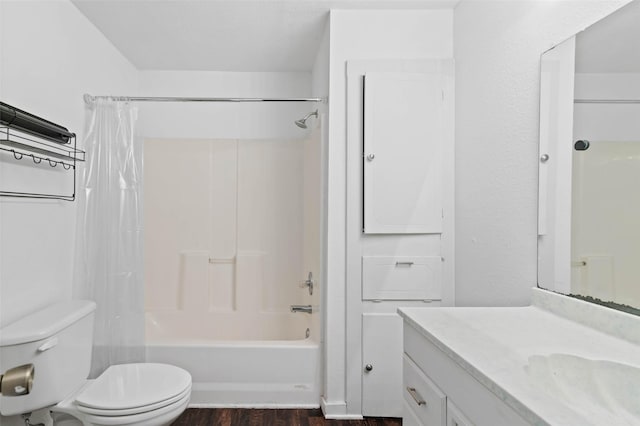 full bathroom with shower / bathtub combination with curtain, vanity, toilet, and hardwood / wood-style floors