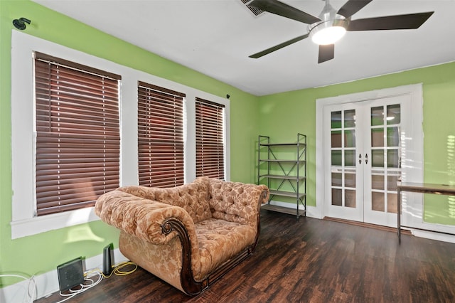 living area with dark hardwood / wood-style flooring, french doors, and ceiling fan