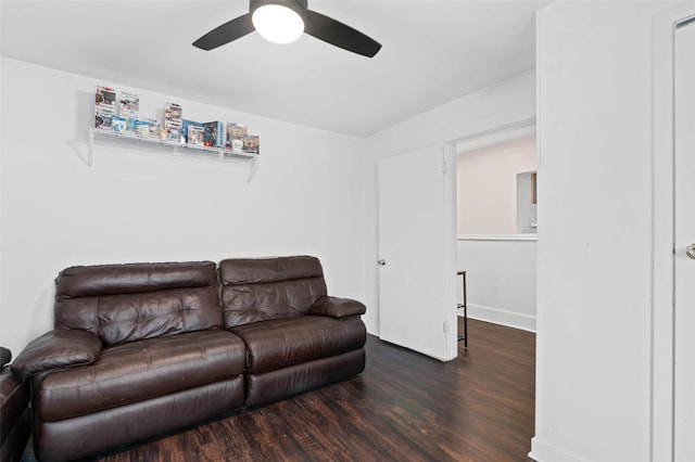 living room with ceiling fan and dark hardwood / wood-style floors