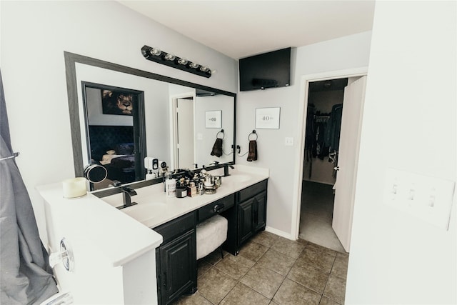 bathroom with vanity and tile patterned flooring