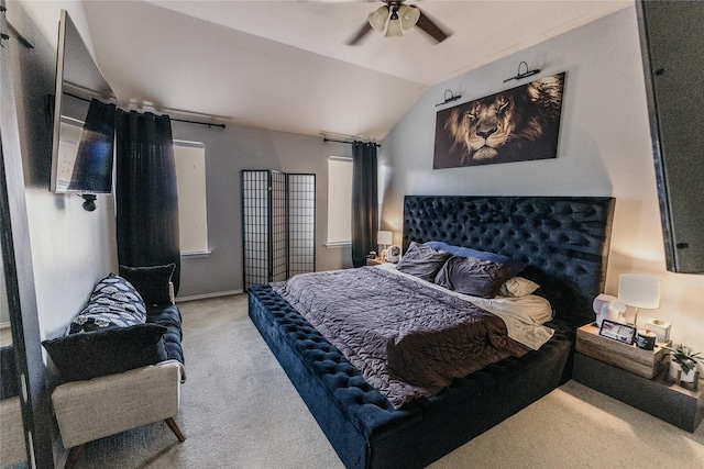 carpeted bedroom featuring ceiling fan and vaulted ceiling