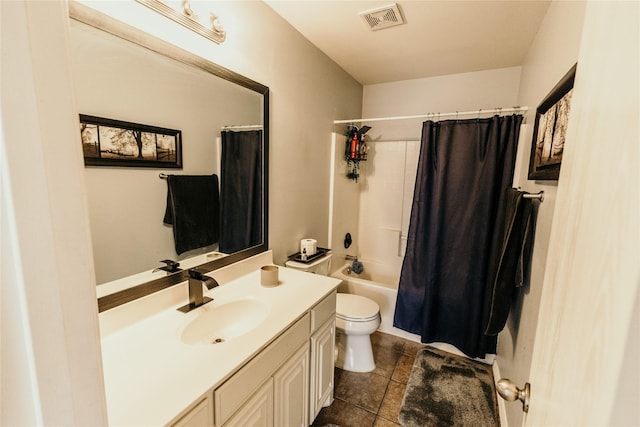 full bathroom featuring shower / tub combo with curtain, vanity, tile patterned flooring, and toilet