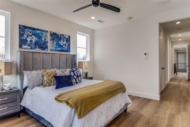 bedroom with wood-type flooring and ceiling fan