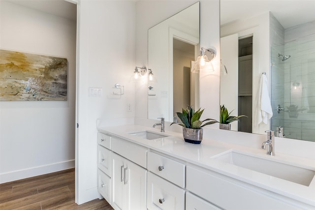 bathroom featuring vanity, hardwood / wood-style floors, and an enclosed shower