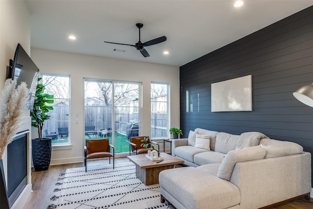 sunroom / solarium with ceiling fan and a wealth of natural light