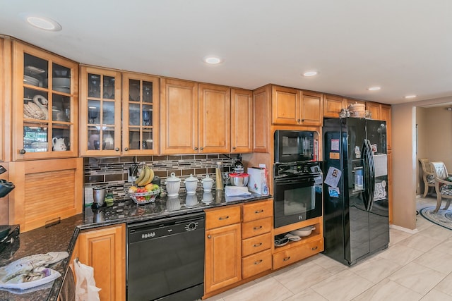 kitchen with tasteful backsplash, light tile patterned floors, black appliances, and dark stone counters