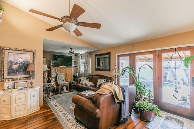 living room with dark hardwood / wood-style flooring and vaulted ceiling