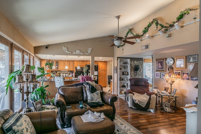 living room with ceiling fan, wood-type flooring, high vaulted ceiling, and a wealth of natural light