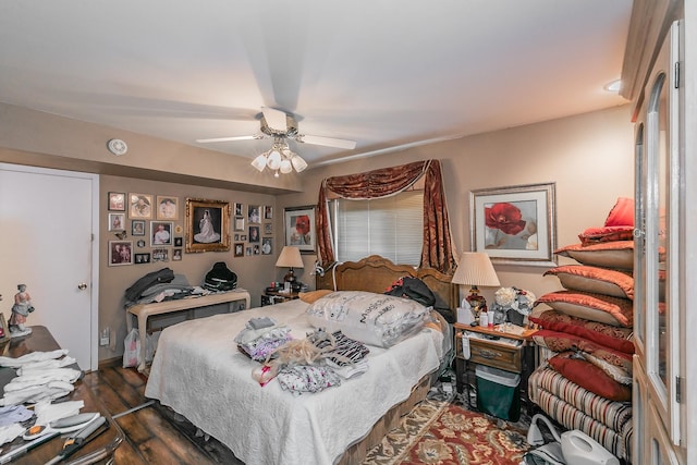 bedroom with ceiling fan and dark hardwood / wood-style flooring