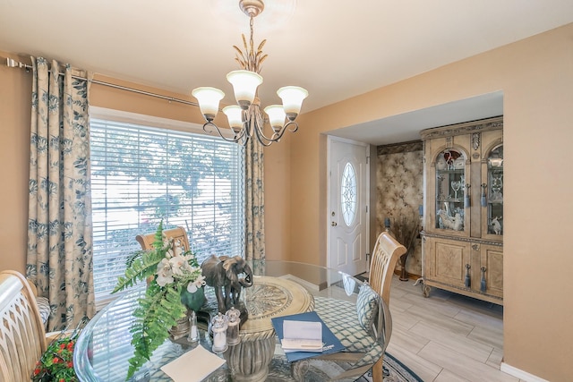 dining room with a notable chandelier